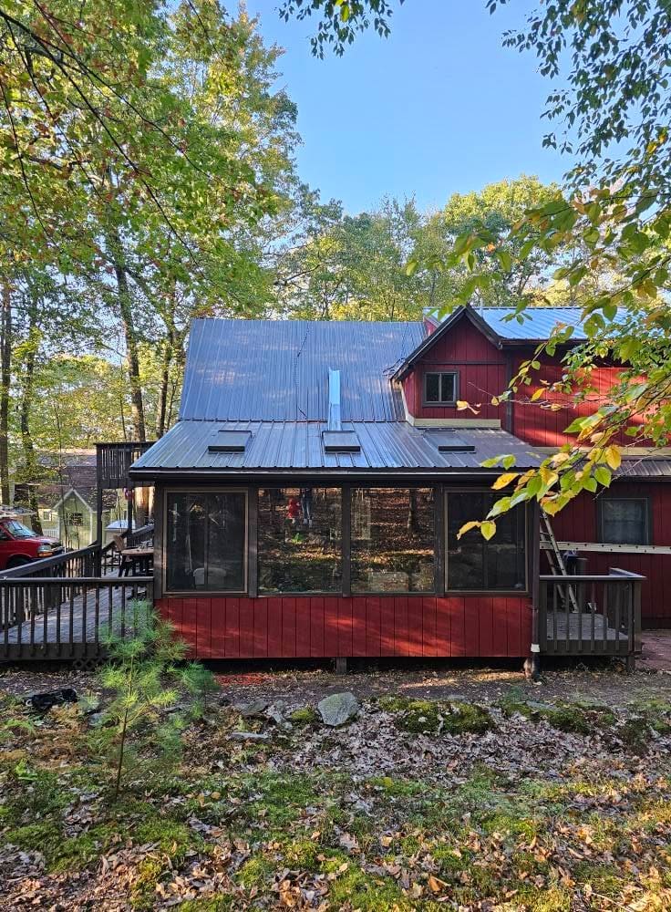 Finished metal roof over the home's sunroom addition